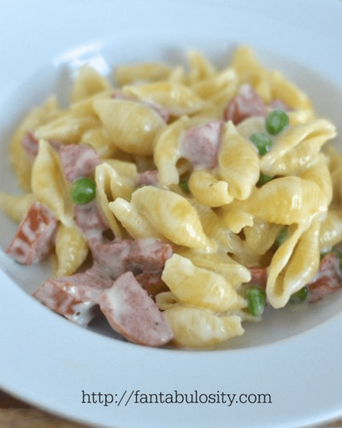 Smoked sausage with noodles and peas