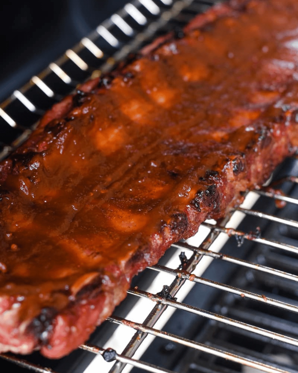 Chipotle apple butter ribs on the grill