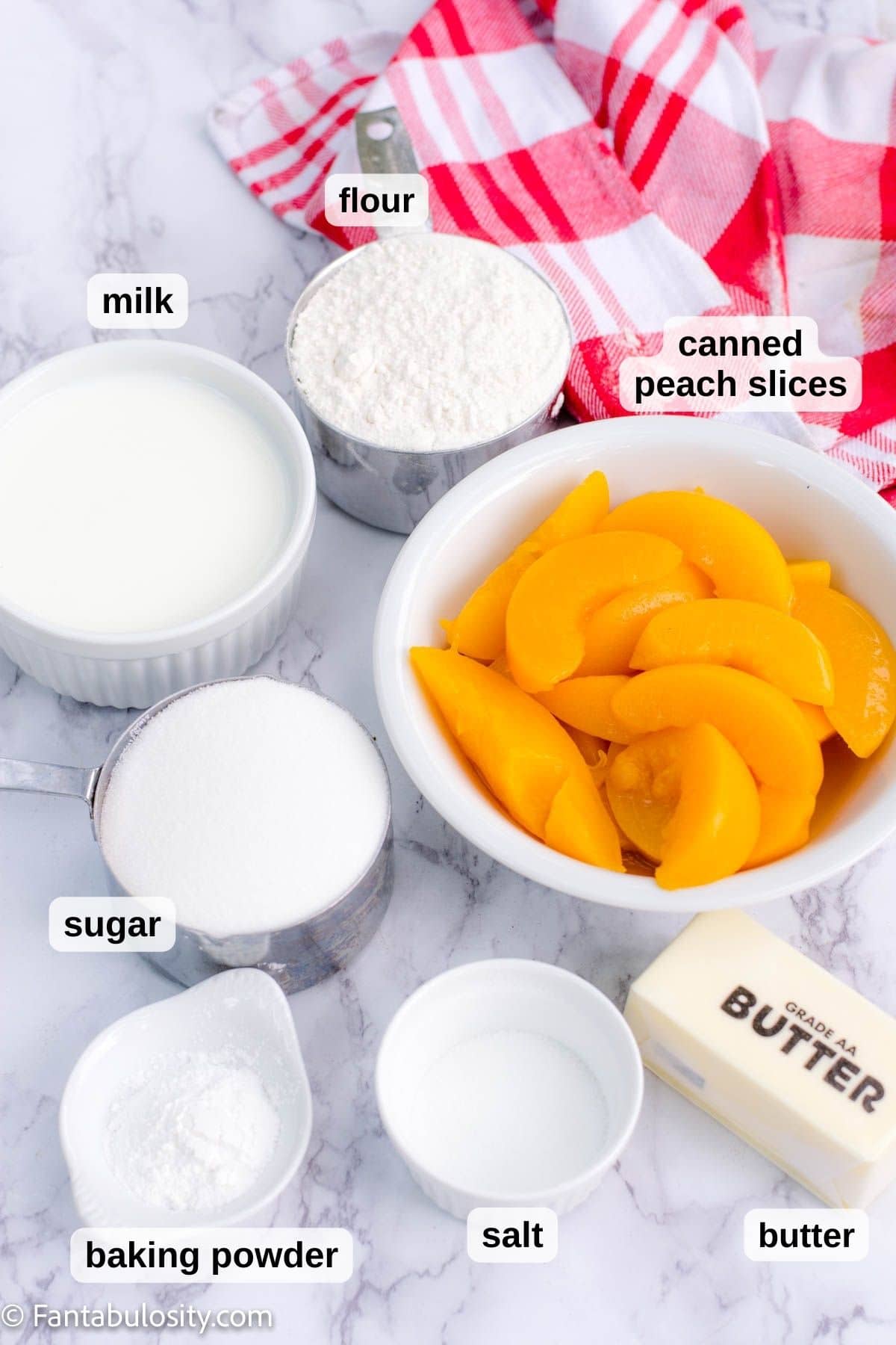 Ingredients for peach cobbler on table.