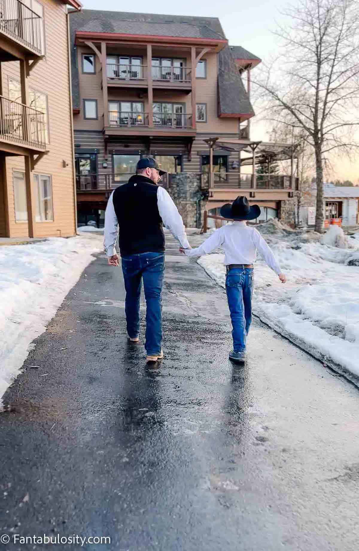 Man and son walking at The Lodge at Whitefish.