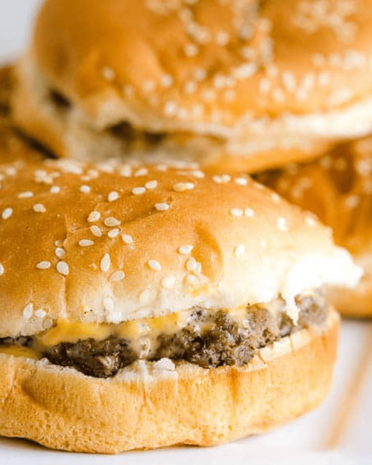 Oven baked hamburgers with cheese and sesame seed bun
