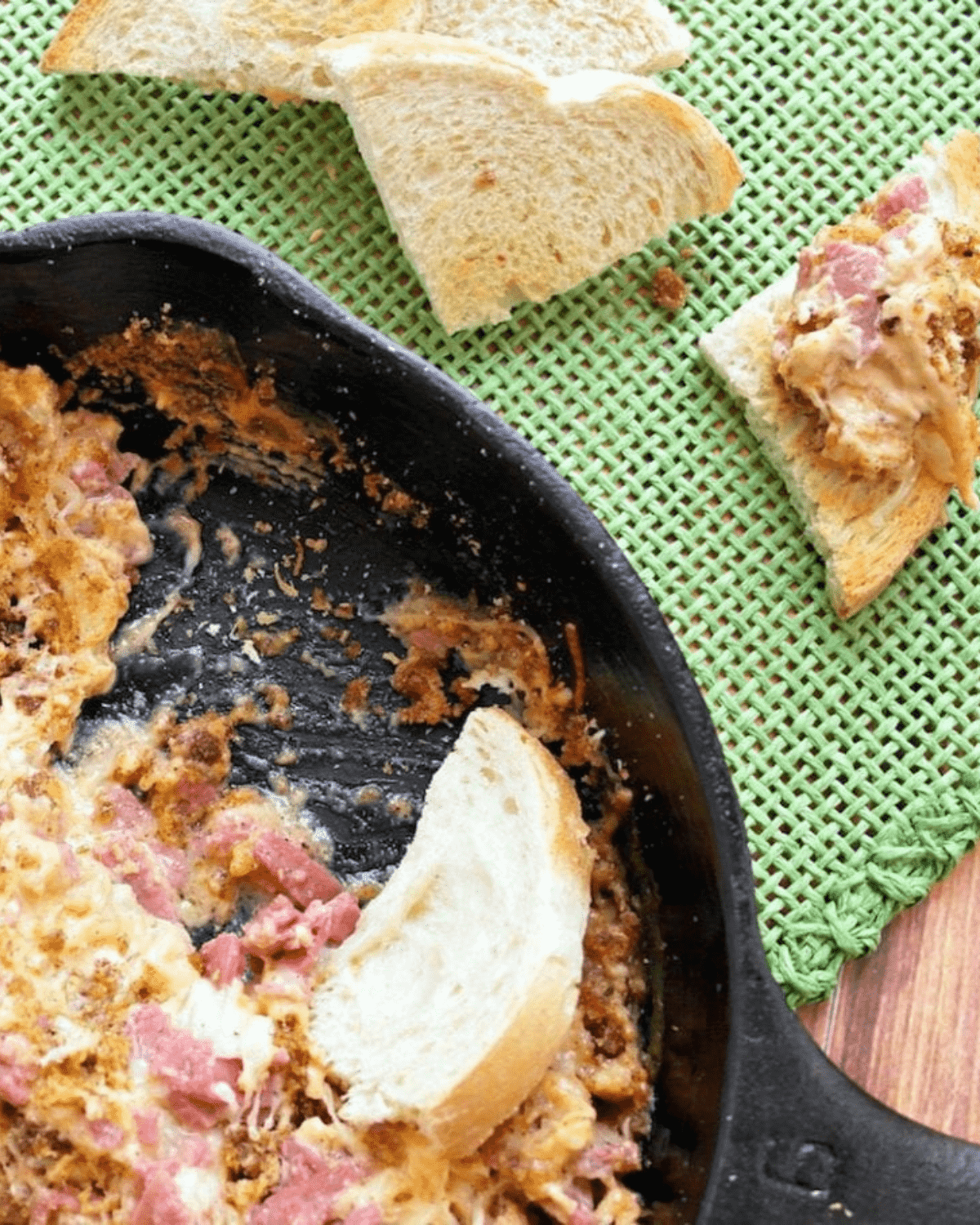 Reuben dip with rye bread in a skillet