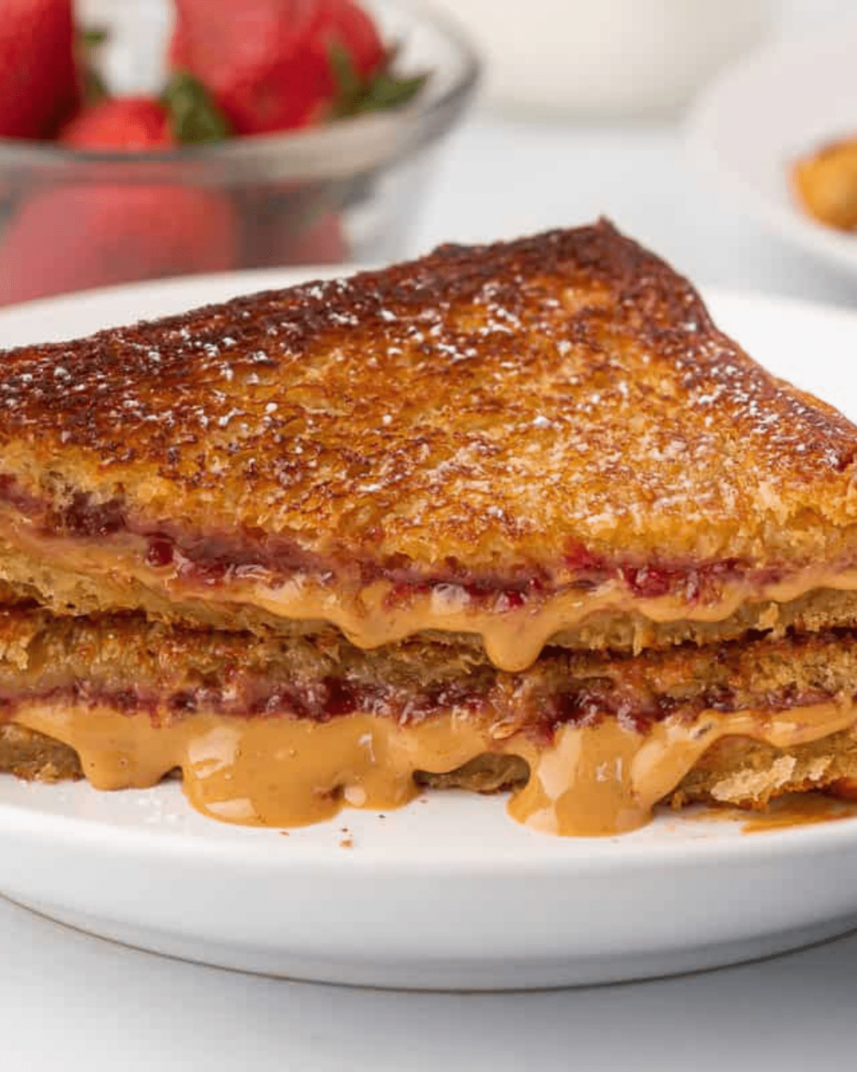 fried peanut butter and jelly sandwich on a white plate