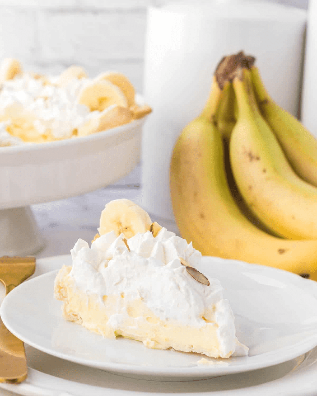 Banana cream pie slice with banana bunch
