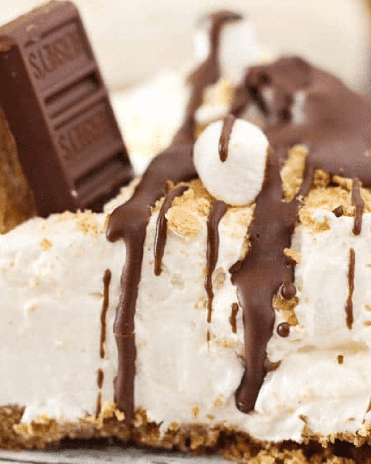 No bake s'mores cheesecae with marshmallows, hershey bars
