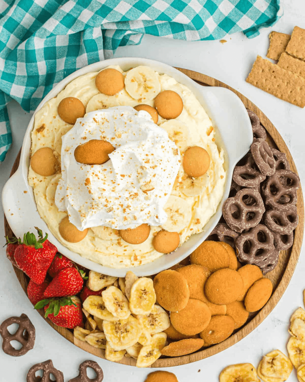 Banana pudding dip with wafers, fruit and pretzels
