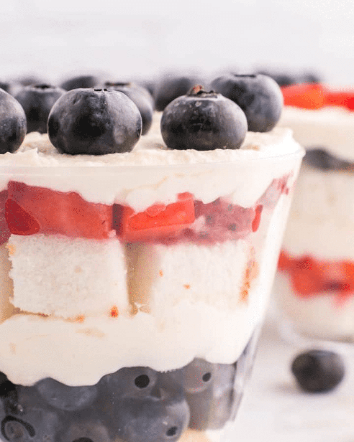 angel food cake cubes with blueberries and strawberries.
