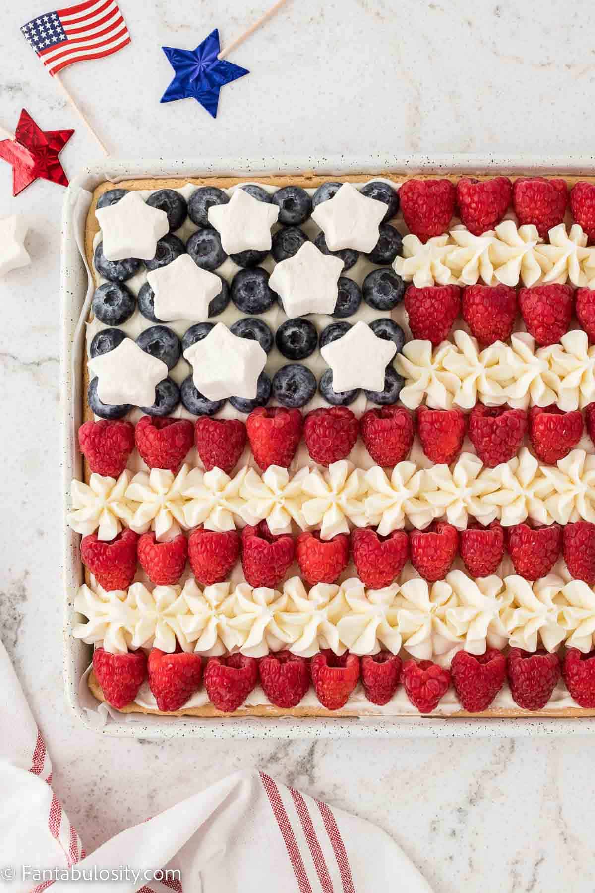 Star marshmallows added to American flag fruit pizza.