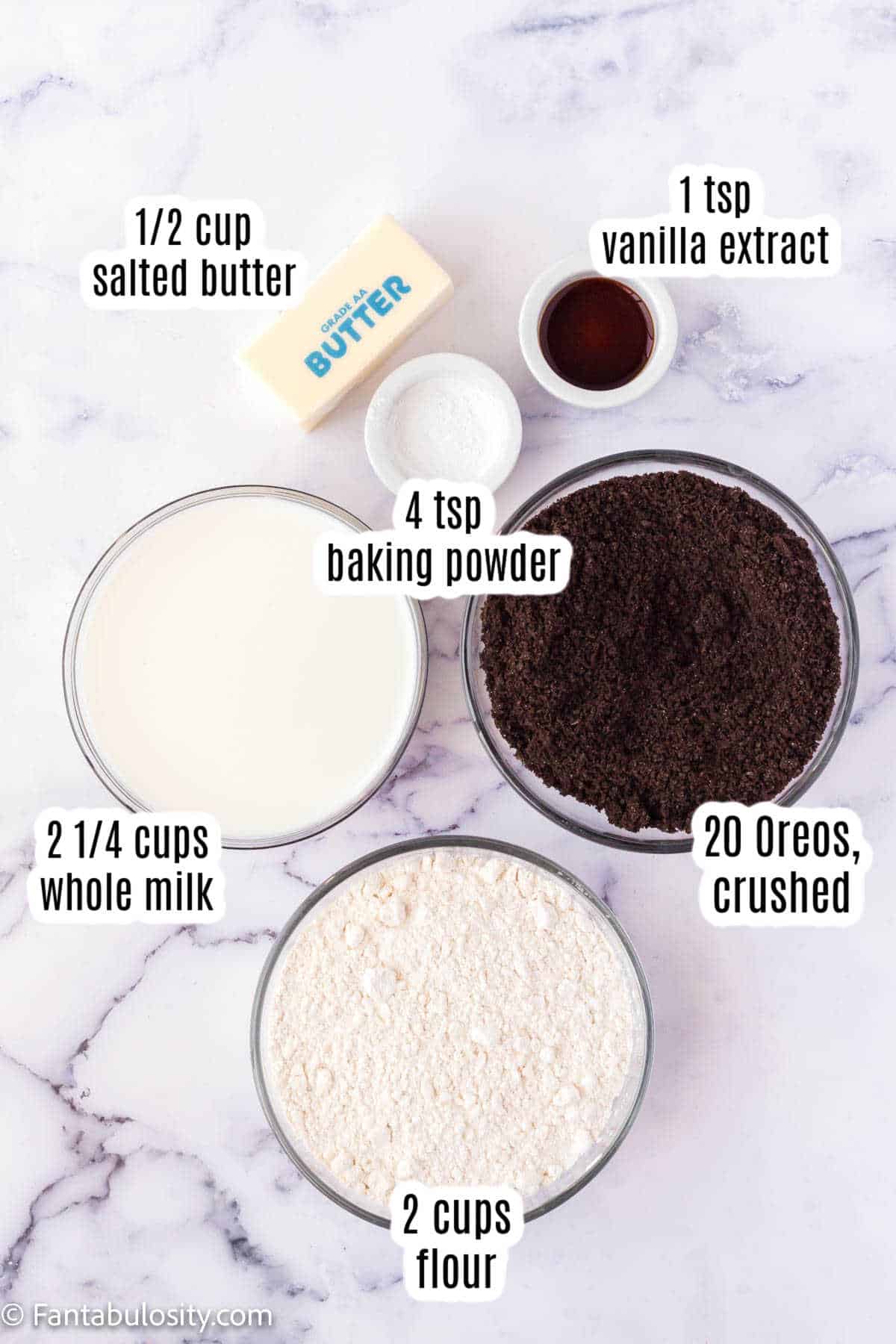 Labeled ingredients on marble counter for Oreo pancakes.