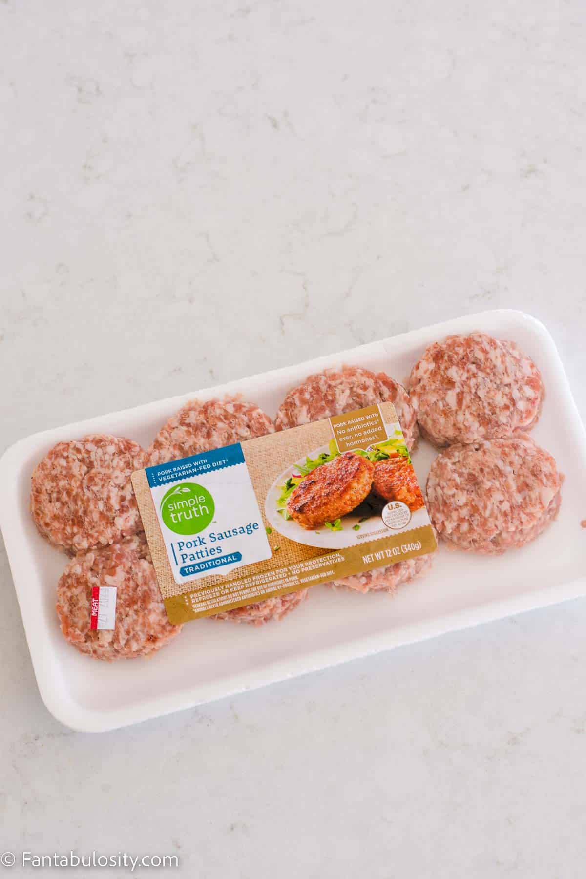 Store-bought, packaged sausage patties, sitting on the kitchen counter.