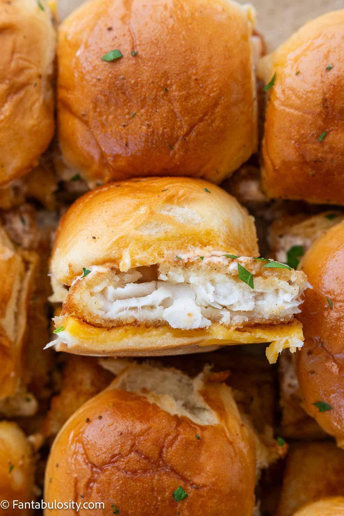 Fish sliders on cookie sheet, ready to eat.