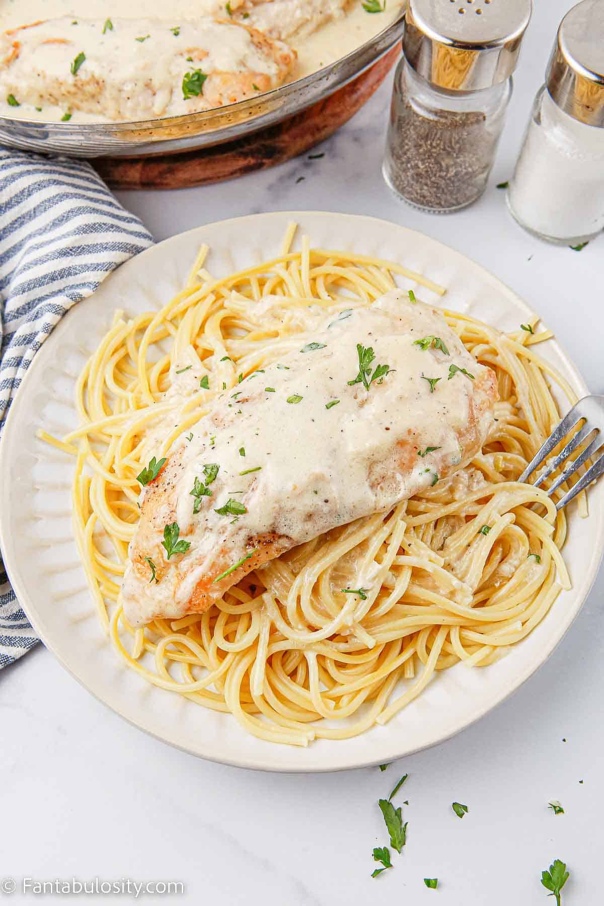 Creamy Caesar chicken on pasta.