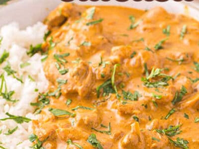 Close up of a bowl of butter chicken, next to rice with cilantro on top.