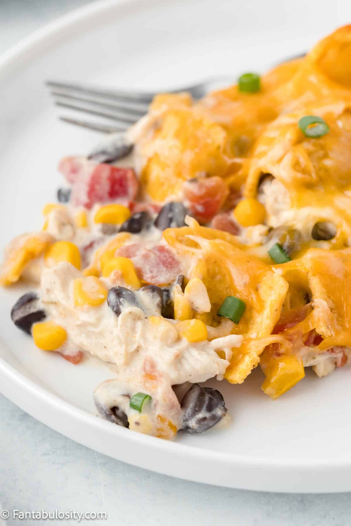 Frito chicken casserole serving on a white plate.