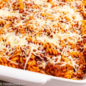 Sausage pasta bake in white baking dish.