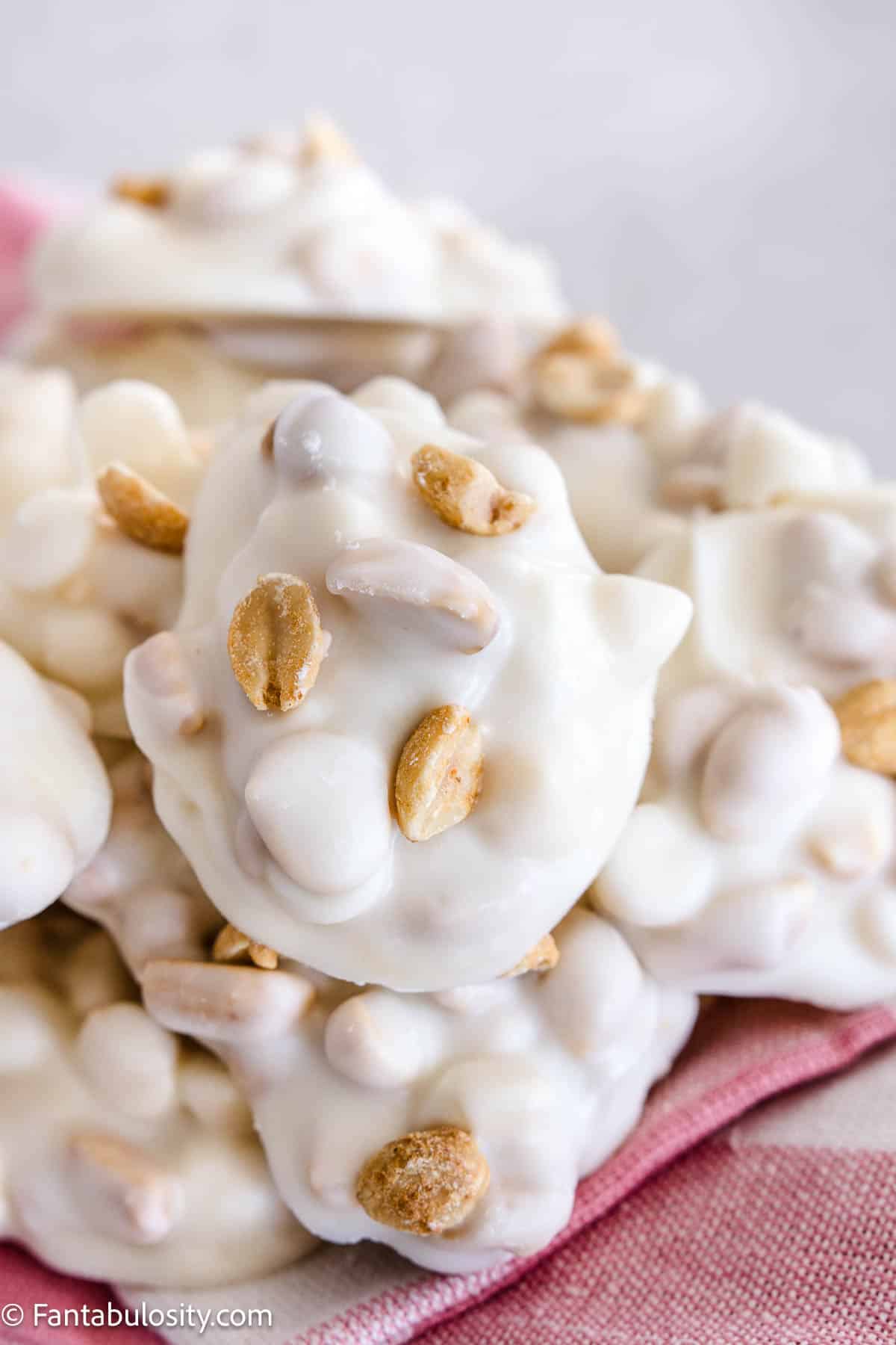 White chocolate crock pot candy piled on fabric napkin.