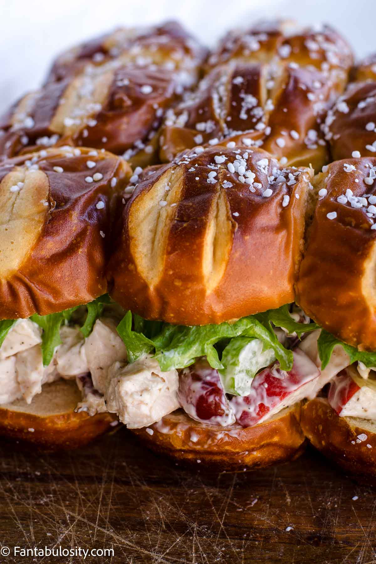 Pretzel slider buns with chicken salad to make sandwiches.