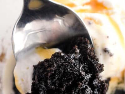 Close up of Oreo mug cake with bite in spoon.