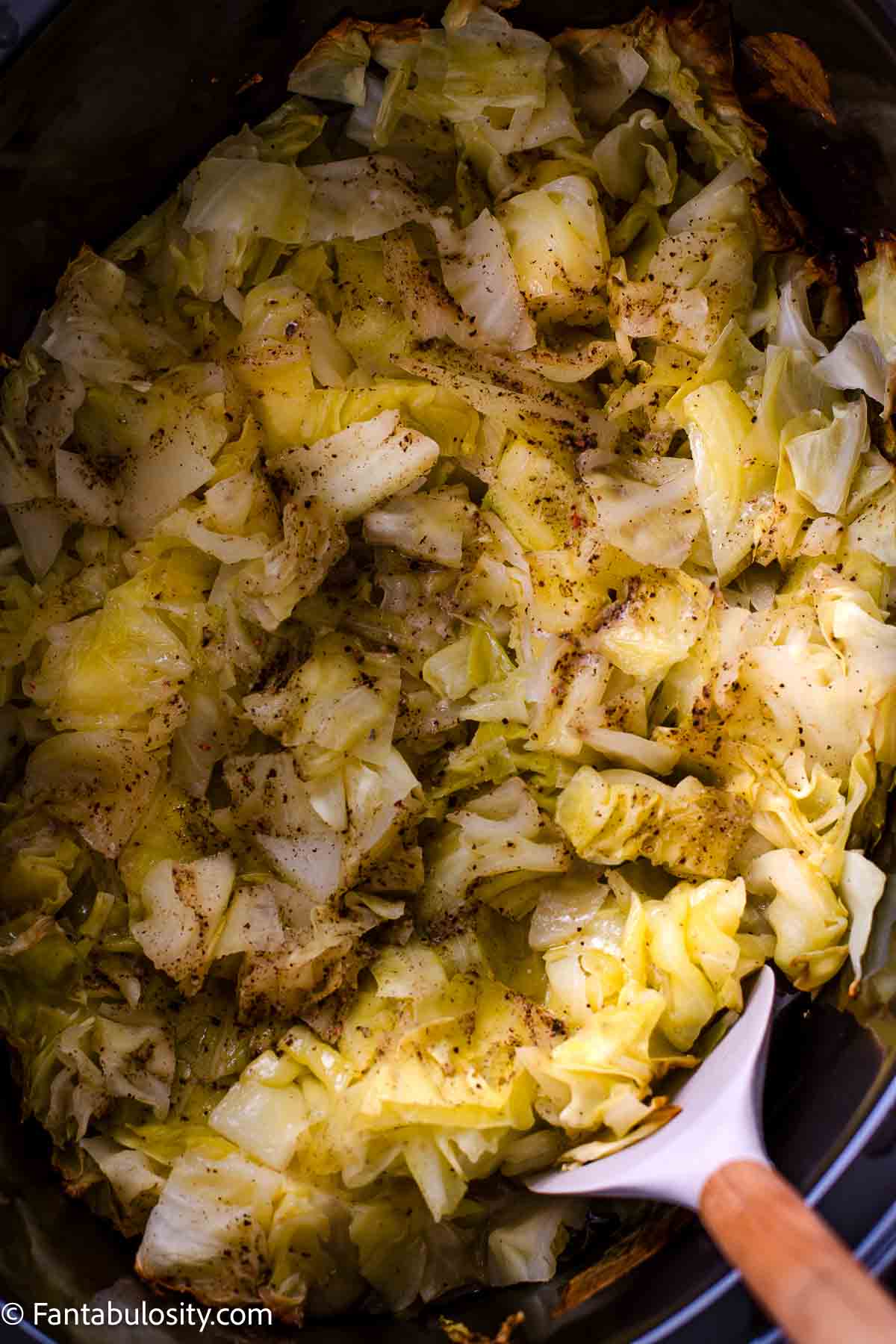 Cooked cut up cabbage in slow cooker.