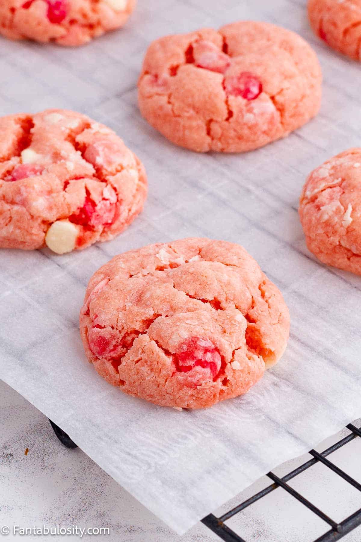 Strawberry cake mix cookies on cooling rack.