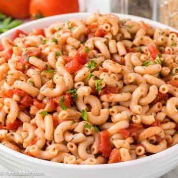 Macaroni and Tomatoes in white bowl.