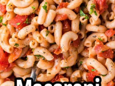 Close-up of macaroni and tomatoes in white bowl.