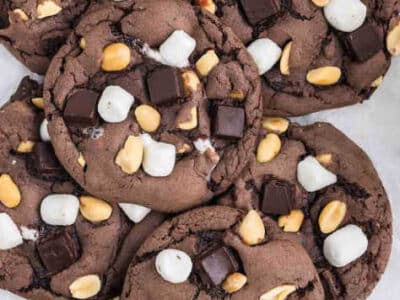 Rocky Road Cookies placed on kitchen counter in a flat pile.