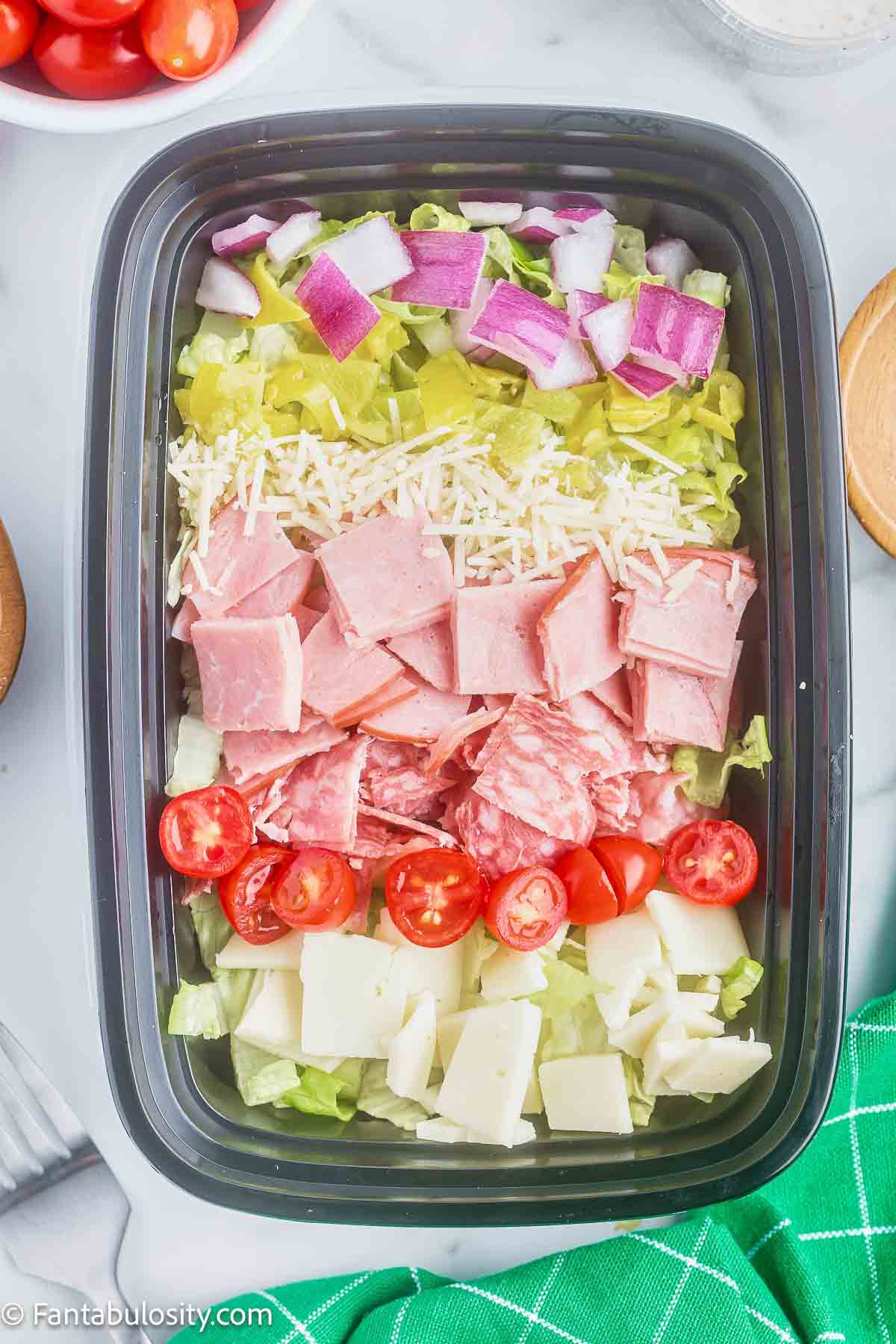 Meal prep grinder salad in a container.