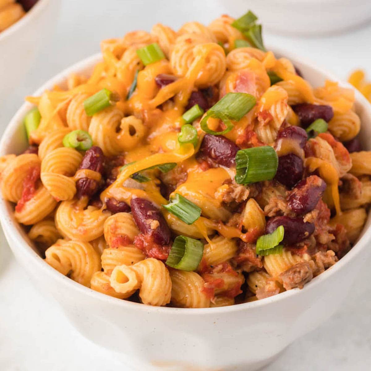 Bowl of cheesy chili mac made in the Instant Pot.
