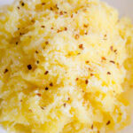 Spaghetti squash that was cooked in the Instant Pot, and has red pepper and parmesan cheese on top.
