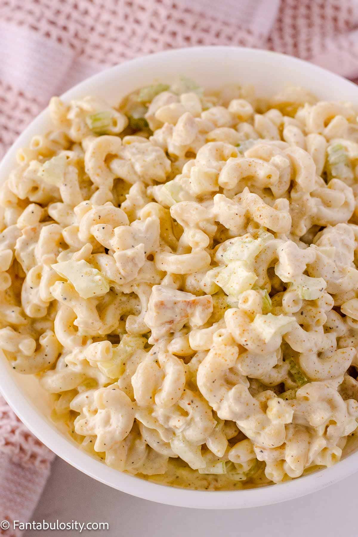 Chicken macaroni salad in round serving bowl.