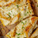 Chicken Alfredo garlic bread slices.