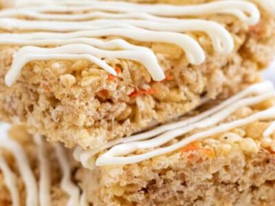 Carrot Cake Rice Krispie Treats stacked on top of one another.