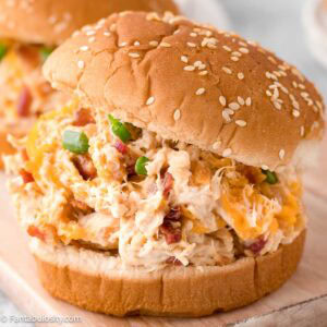 Crack Chicken Sandwich on wooden cutting board.