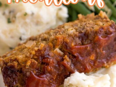 Stove Top Stuffing meatloaf slice on a serving of mashed potatoes, next to green beans.