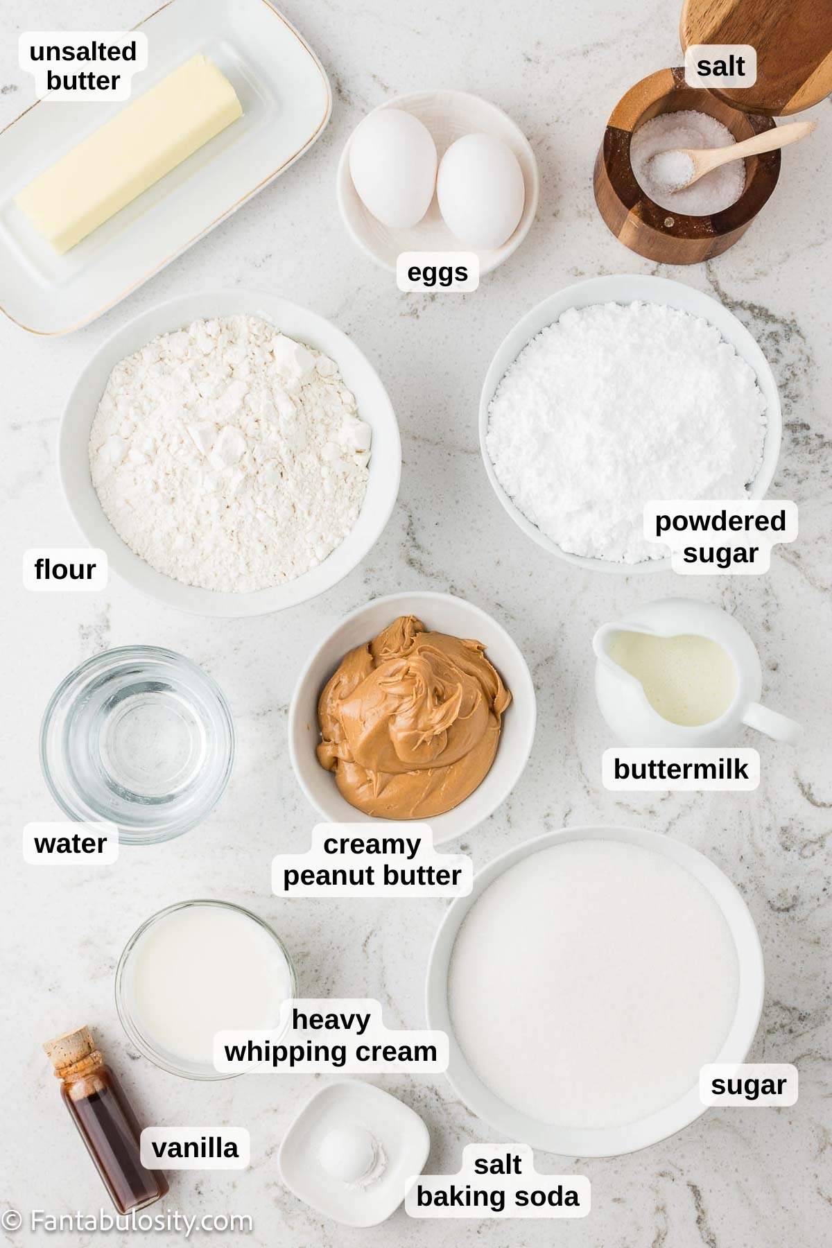 Ingredients in bowls that are used for making peanut butter cake with peanut butter icing.