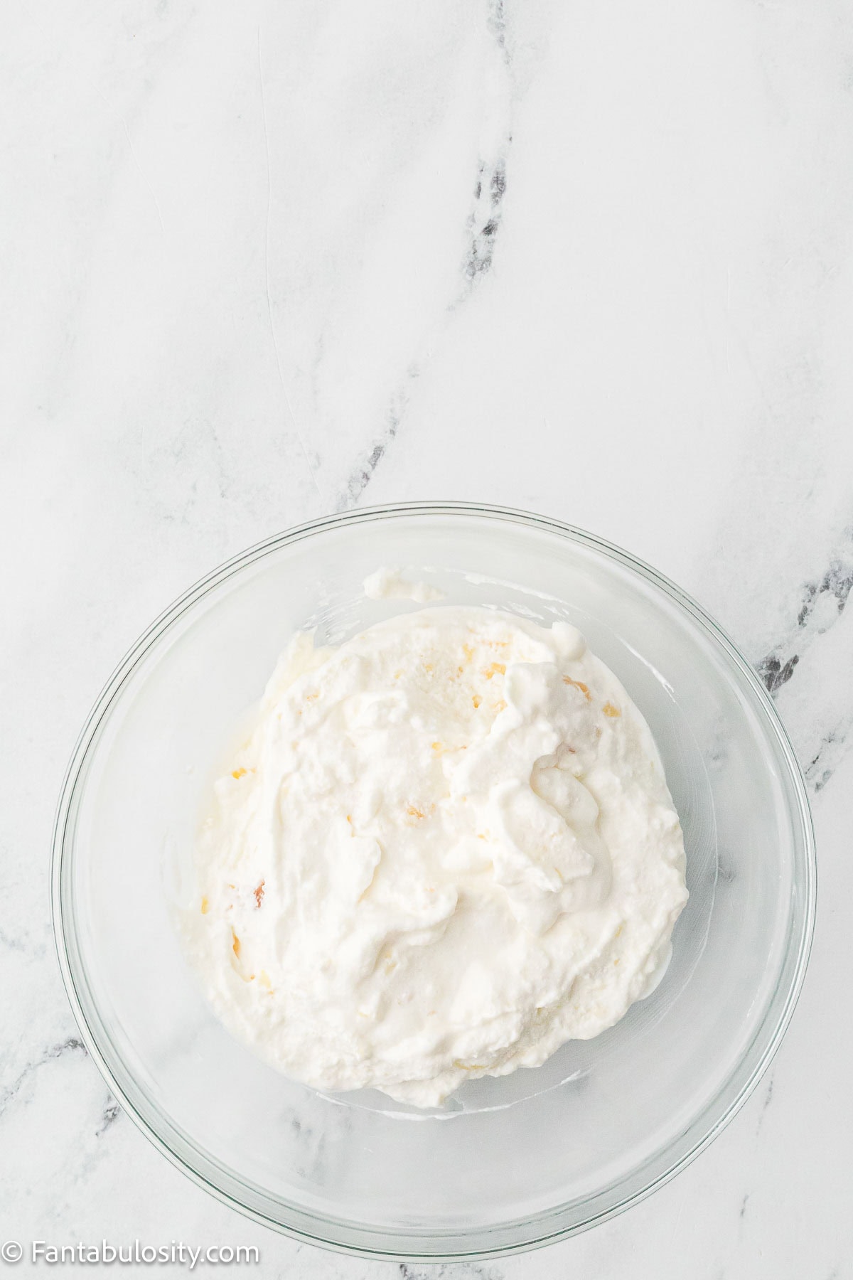 Pineapple and whipped cream mixed together.