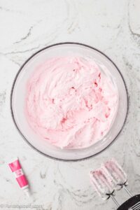Pink lemonade frosting in mixing bowl.