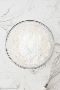 Dry ingredients in mixing bowl for pink lemonade cake.