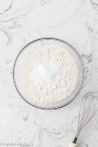 Flour, baking powder, salt, and sugar in mixing bowl.