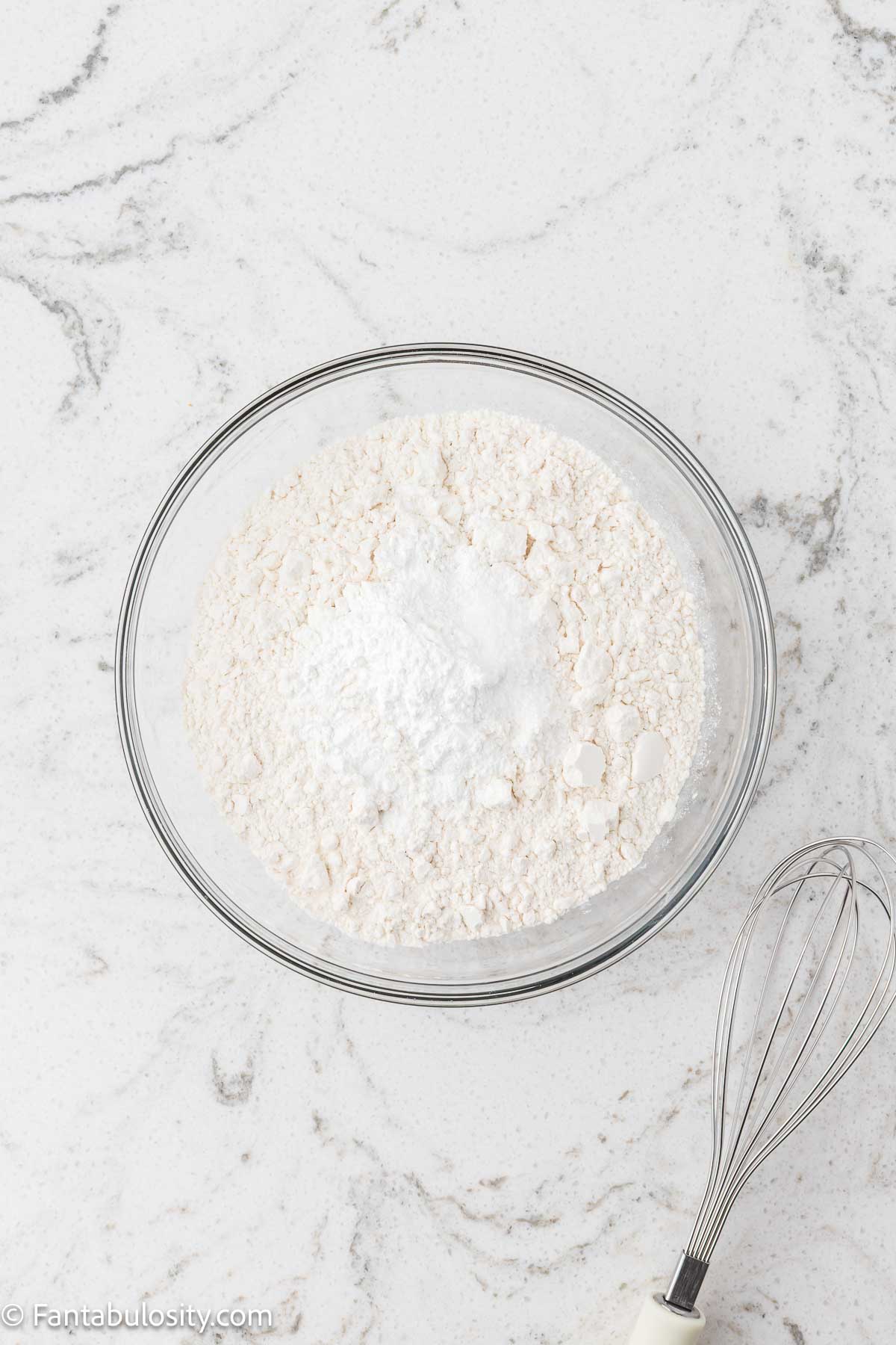 Flour, baking powder, salt, and sugar in mixing bowl.