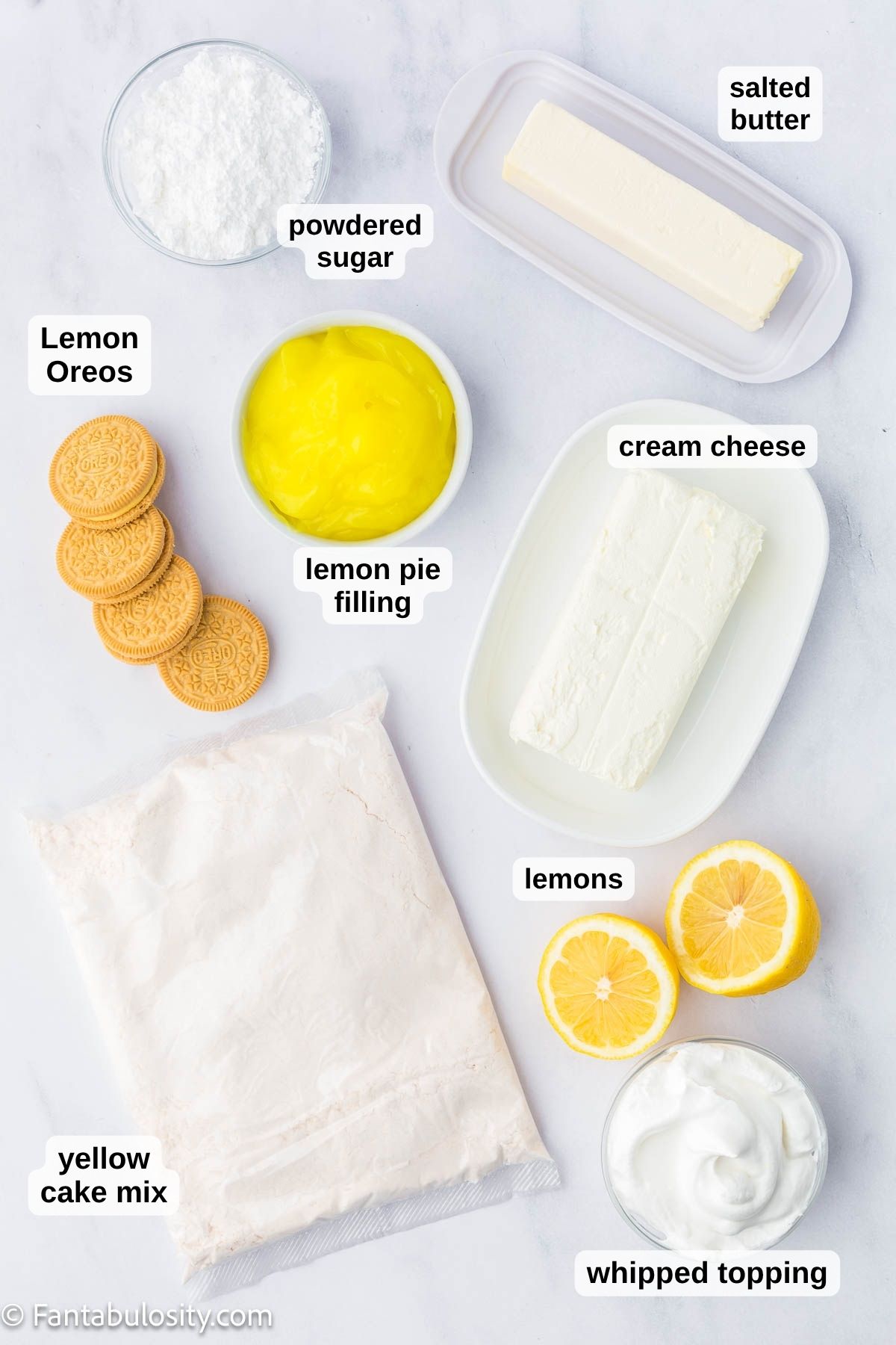 Labeled ingredients for lemon dump cake sitting on kitchen counter.