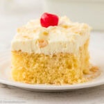 Slice of Pina Colada sheet cake on a plate.