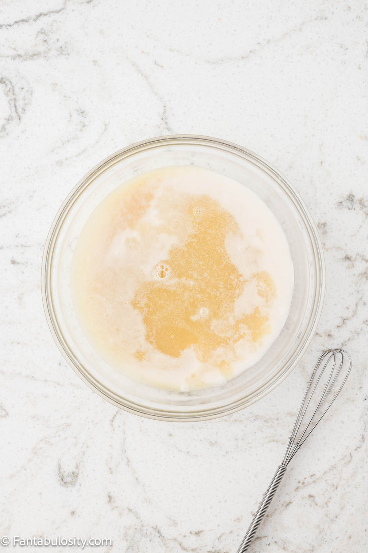 Cream of coconut, pineapple juice, lime juice and rum extract in mixing bowl.