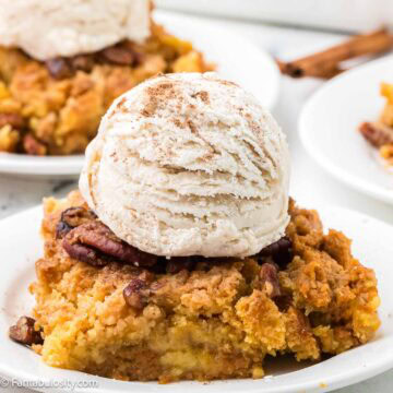 Pumpkin Dump Cake serving on round plate.