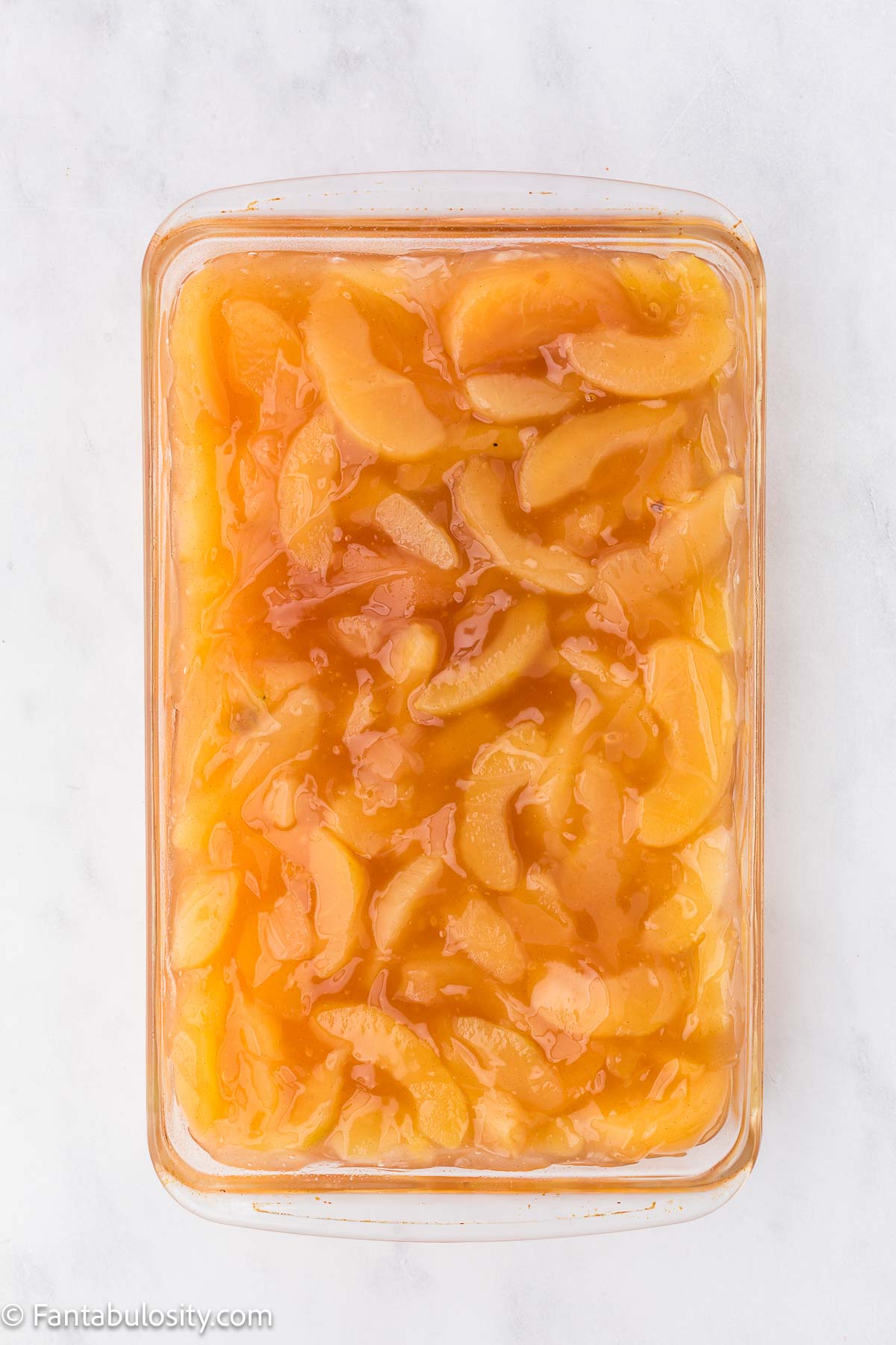 Canned apple pie filling in 9x13 baking dish.
