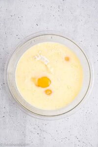Cake mix, eggs, added to milk and butter in mixing bowl.