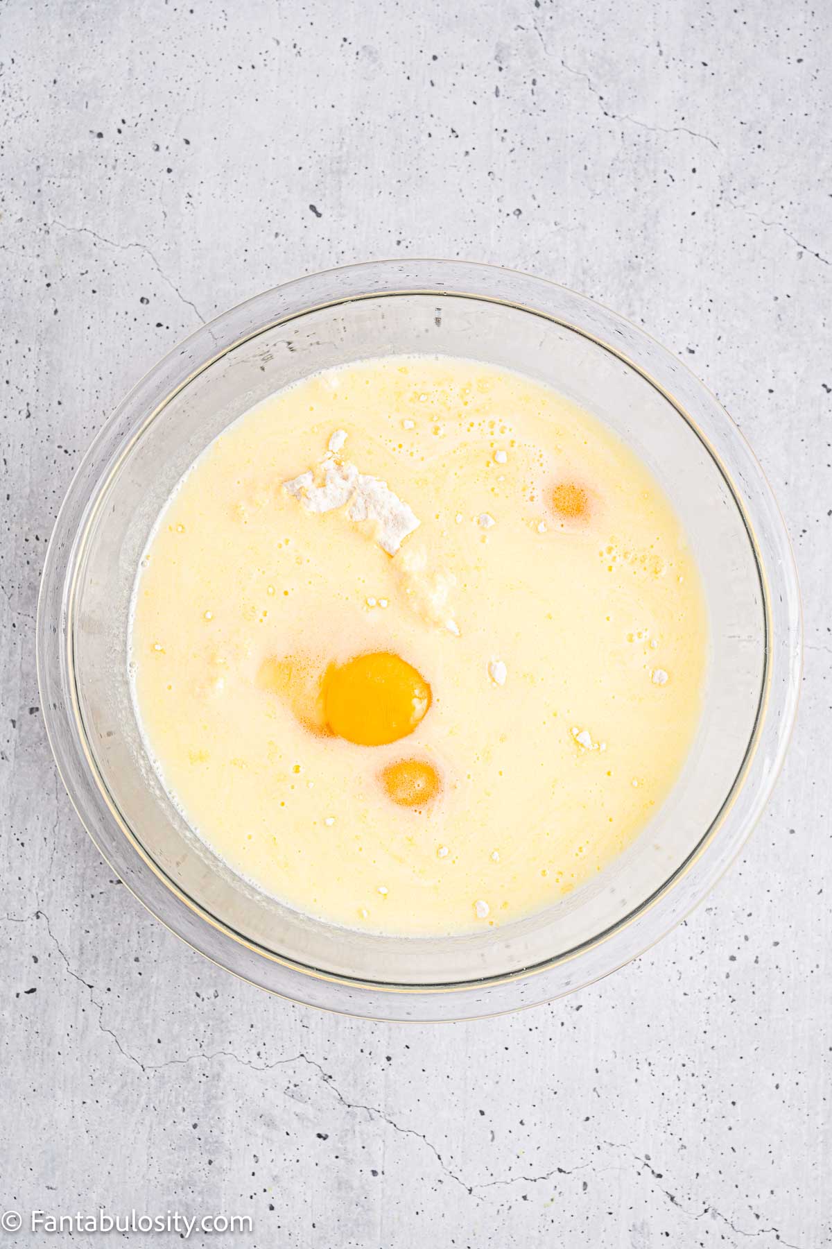 Cake mix, eggs, added to milk and butter in mixing bowl.