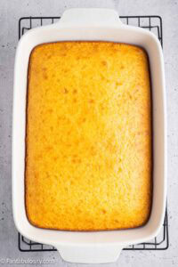 Baked Boston Cream Poke Cake in baking pan.