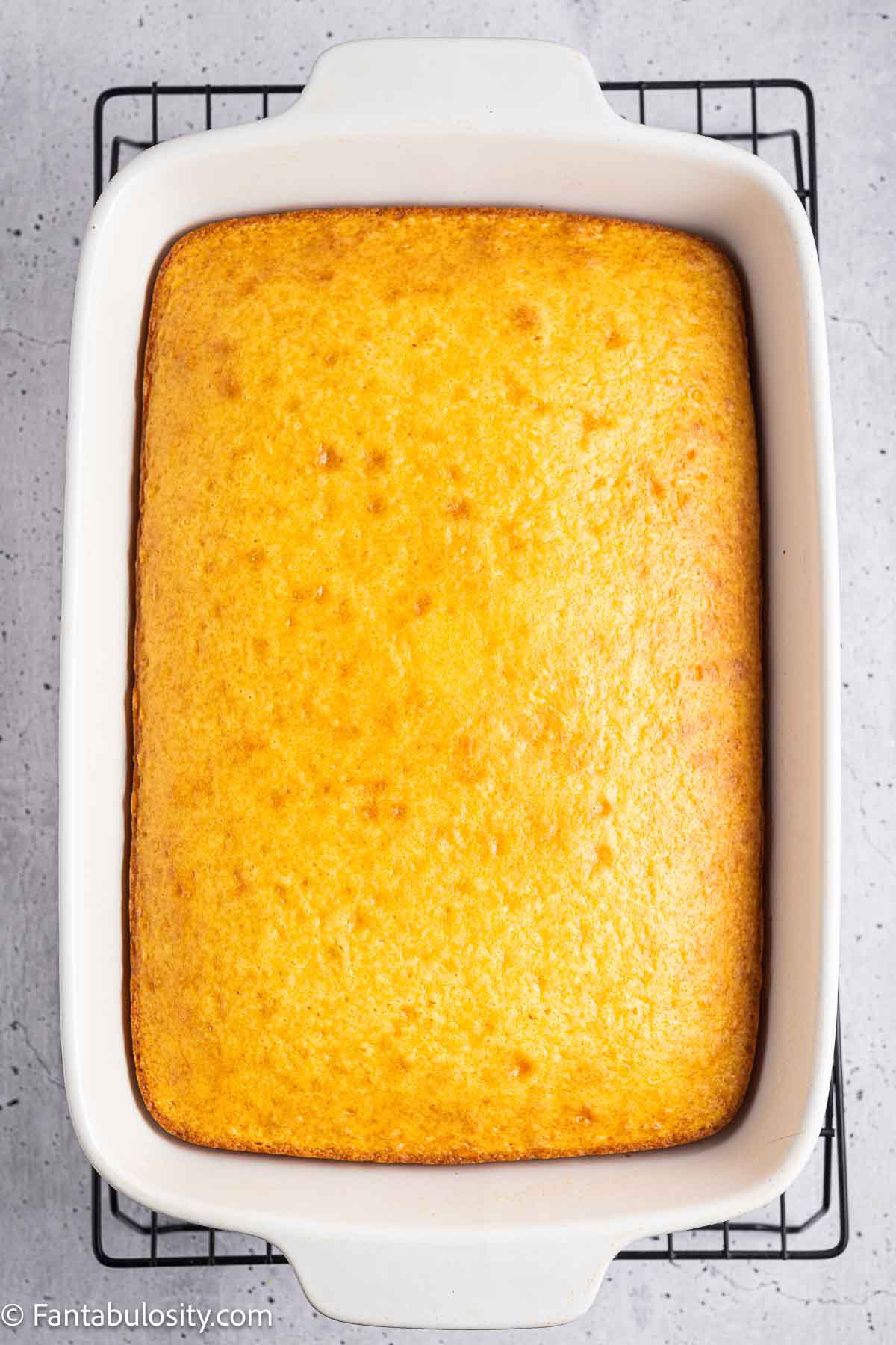 Baked Boston Cream Poke Cake in baking pan.